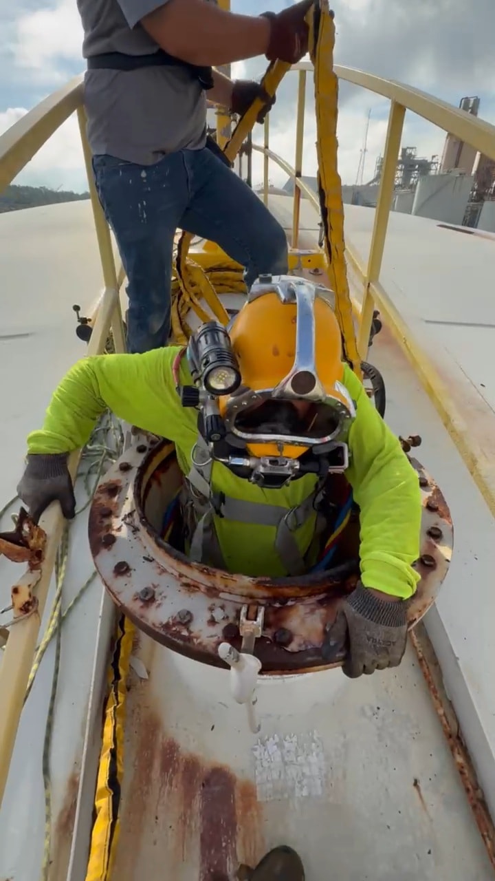 Commercial diver working underwater on a structure